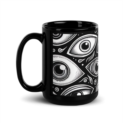 Schwarze Tasse mit schwarz weißen Augen bedruckt Seitenansicht links