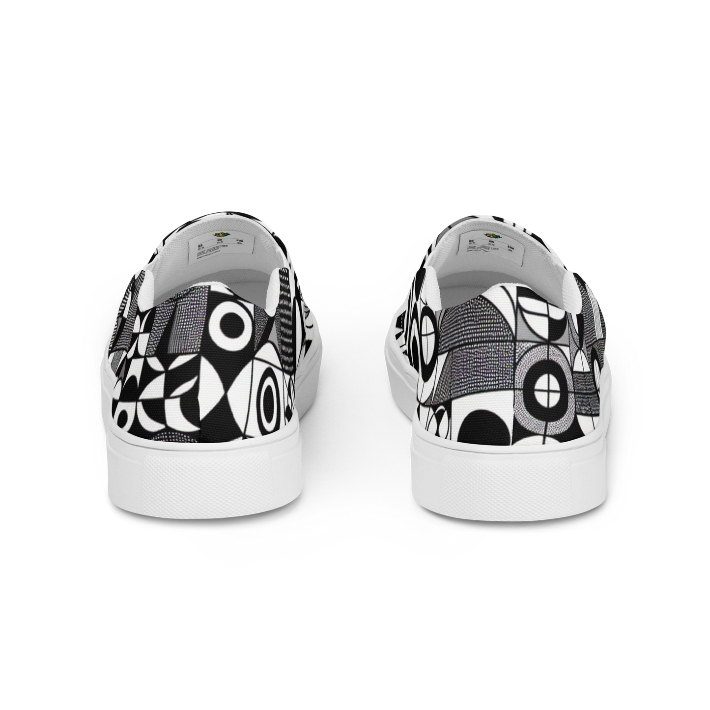 Zwei Herren Slip Ons mit schwarz weißem symmetrischem Muster Hintenansicht