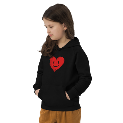 Mädchen trägt schwarzen Kinder Hoodie mit rotem lachenden Herz Brustprint