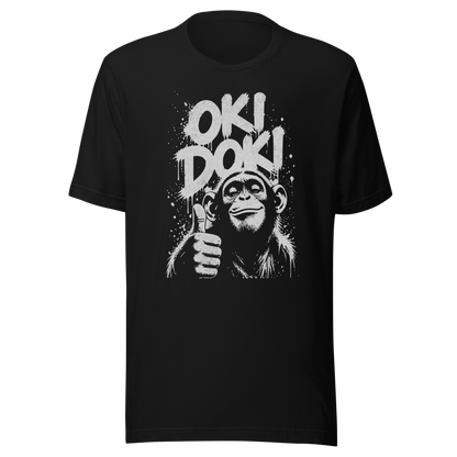 Schwarzes T-Shirt mit Affen der Daumen hoch zeigt und den Worten Oki Doki im Graffiti Style