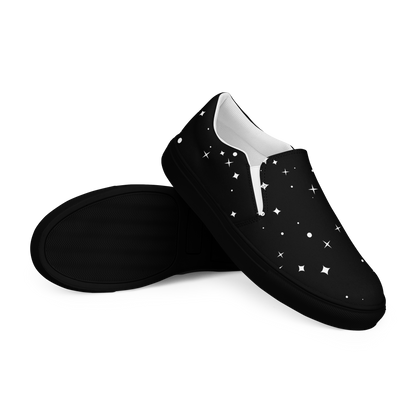 Schwarze Damen Slipper mit weißen Sternen und Punkten bedruckt und schwarzem Gummirand Seitenansicht