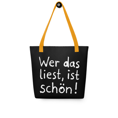 Schwarzer All-Over Stoffbeutel mit kindlichem Wer das liest, ist schön! Print und orangen Henkeln