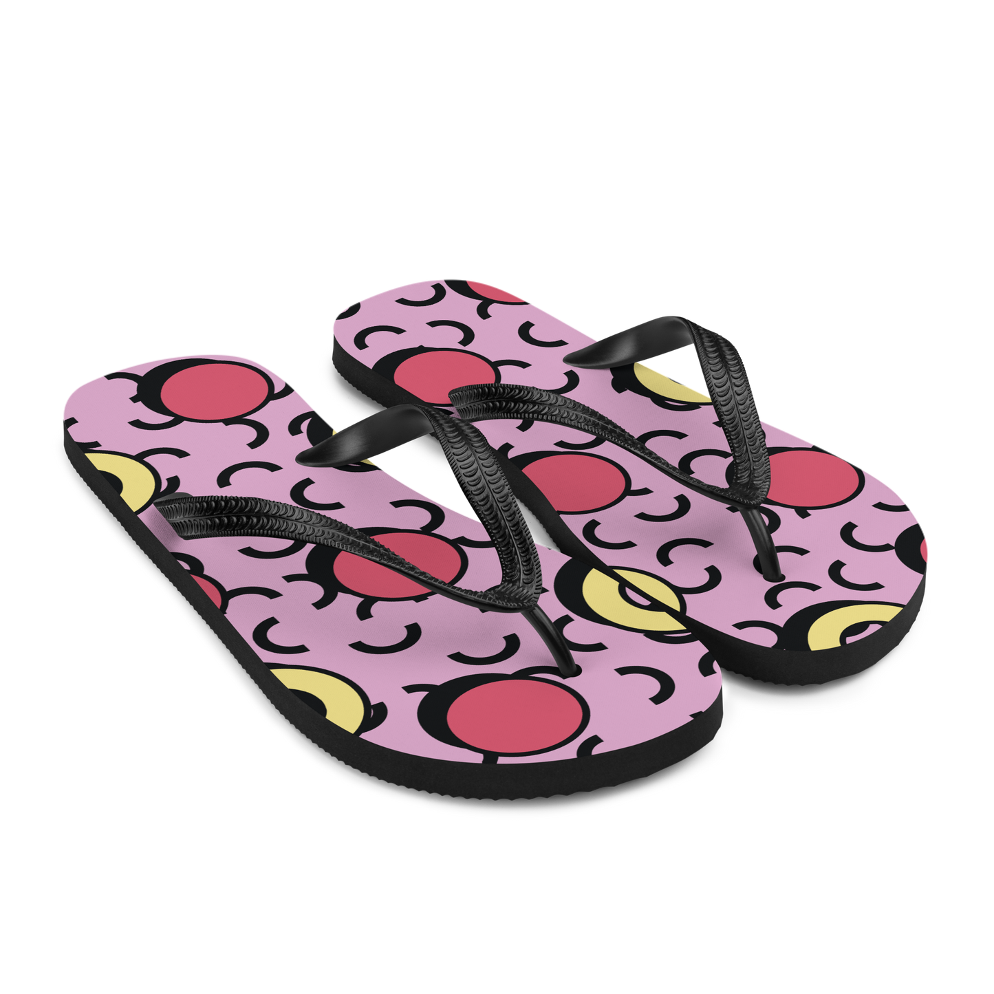Seitenansicht von zwei Flip-Flops in rosa mit gelben und roten Formen