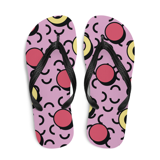 Obenansicht von zwei Flip-Flops in rosa mit roten und gelben Formen